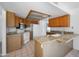 Functional kitchen featuring granite countertops, white appliances, and wooden cabinets at 4319 E Tanglewood Dr, Phoenix, AZ 85048