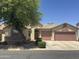 Charming single-story home featuring a two-car garage, desert landscaping, and a welcoming entrance at 45290 W Buckhorn Trl, Maricopa, AZ 85139