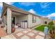 Cozy backyard patio with pavers, covered area, and lush landscaping, perfect for outdoor relaxation at 4701 S Siphon Draw Rd, Apache Junction, AZ 85119