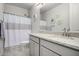 Bright bathroom featuring a white granite countertop, gray vanity, and a shower and tub combination at 4701 S Siphon Draw Rd, Apache Junction, AZ 85119