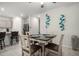 Cozy dining area adjacent to the kitchen with a modern table setting and stylish decor elements at 4701 S Siphon Draw Rd, Apache Junction, AZ 85119