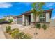 Beautiful single-story home with stone accents, a two-car garage, and xeriscaping with lush landscaping at 4701 S Siphon Draw Rd, Apache Junction, AZ 85119