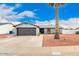 Charming single-story home featuring desert landscaping, a large palm tree, and a well-maintained front yard at 4815 W Charleston Ave, Glendale, AZ 85308
