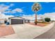 Spacious two-car garage with an extended driveway and low maintenance landscaping at 4815 W Charleston Ave, Glendale, AZ 85308