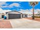 Spacious two-car garage with an extended driveway and low maintenance landscaping at 4815 W Charleston Ave, Glendale, AZ 85308