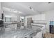 Spacious kitchen with granite countertops, stainless steel appliances, island with seating, and light wood floors at 4815 W Charleston Ave, Glendale, AZ 85308