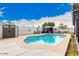 Backyard pool area featuring a pristine pool, a storage shed, a barbecue grill, and mature trees at 4815 W Charleston Ave, Glendale, AZ 85308