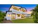 Expansive backyard with lush lawn, modern home exterior, and covered patio areas at 4911 E Amelia Ave, Phoenix, AZ 85018