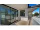 Modern balcony featuring black-framed sliding glass doors and sleek, minimalist design, offering a stylish outdoor living space at 4911 E Amelia Ave, Phoenix, AZ 85018
