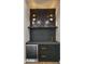 Stylish bar with dark cabinets, marble countertops, a wine fridge, and gold accents at 4911 E Amelia Ave, Phoenix, AZ 85018