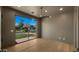 Bedroom showcasing a large window with neighborhood views and contemporary finishes at 4911 E Amelia Ave, Phoenix, AZ 85018
