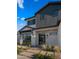 Close up of modern style, two-story home with professional landscaping and large windows at 4911 E Amelia Ave, Phoenix, AZ 85018