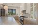Gourmet kitchen featuring a large center island, custom cabinets, and stainless steel range at 4911 E Amelia Ave, Phoenix, AZ 85018