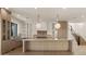 Gourmet kitchen featuring a large center island, custom cabinets, and pendant lighting at 4911 E Amelia Ave, Phoenix, AZ 85018