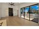 Spacious living area with a wet bar, and large windows providing outdoor views at 4911 E Amelia Ave, Phoenix, AZ 85018