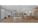 Open-concept living area with hardwood floors, fireplace, and modern kitchen island at 4911 E Amelia Ave, Phoenix, AZ 85018
