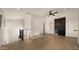 Bright and spacious open-concept living area with a wet bar, modern finishes, and hardwood flooring at 4911 E Amelia Ave, Phoenix, AZ 85018