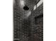 Modern shower featuring dark tile, rainfall shower head, and convenient niche at 4911 E Amelia Ave, Phoenix, AZ 85018