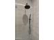 Modern shower with textured tile, rainfall shower head, and sleek fixtures at 4911 E Amelia Ave, Phoenix, AZ 85018