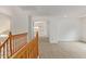 Upstairs hallway with carpet and access to bedrooms at 5123 W Novak Way, Laveen, AZ 85339