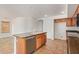 Open concept kitchen with stainless steel appliances and an island with a sink and a dishwasher at 5123 W Novak Way, Laveen, AZ 85339