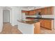 Updated kitchen with stainless steel appliances, a center island, and wood cabinets at 5123 W Novak Way, Laveen, AZ 85339