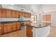 Open kitchen with stainless steel appliances, ample cabinet space, and tile flooring at 5123 W Novak Way, Laveen, AZ 85339