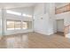 Bright living room featuring wood-look tile floors, high ceilings, and ample natural light at 5123 W Novak Way, Laveen, AZ 85339