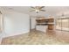 Open-concept living area leading into kitchen with tile floors, a ceiling fan, and neutral paint at 5123 W Novak Way, Laveen, AZ 85339