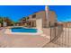Home's backyard featuring a refreshing pool, outdoor seating area, and well-kept landscaping at 6101 W Sunnyside Dr, Glendale, AZ 85304