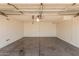 Spacious garage with concrete floor and ample room for parking and storage at 6101 W Sunnyside Dr, Glendale, AZ 85304