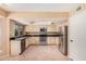 Spacious kitchen featuring stainless steel appliances, tile floor and granite countertops at 6101 W Sunnyside Dr, Glendale, AZ 85304