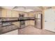 Well-lit kitchen with stainless steel appliances and updated cabinetry at 6101 W Sunnyside Dr, Glendale, AZ 85304