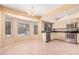 Dining and kitchen area with tile flooring, bright windows and stainless steel appliances at 6101 W Sunnyside Dr, Glendale, AZ 85304