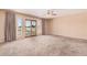 Open living room with sliding glass doors for natural light at 6101 W Sunnyside Dr, Glendale, AZ 85304