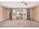 Spacious living room with sliding door access to the outside at 6101 W Sunnyside Dr, Glendale, AZ 85304