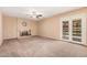 Large living room area featuring a fireplace and outdoor access at 6101 W Sunnyside Dr, Glendale, AZ 85304
