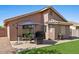 Backyard features artificial turf and a patio seating area at 612 E Racine Pl, Casa Grande, AZ 85122