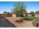 Backyard features gravel landscaping and artificial turf at 612 E Racine Pl, Casa Grande, AZ 85122
