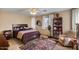 Comfortable bedroom featuring a ceiling fan, a window with natural light, and cozy decor for relaxation at 612 E Racine Pl, Casa Grande, AZ 85122