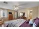 Spacious bedroom featuring neutral tones, ceiling fan, and complementary furniture at 612 E Racine Pl, Casa Grande, AZ 85122