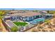 Aerial view of backyard oasis with a pool, spa, outdoor kitchen, and lounge seating at 6320 E Gloria Ln, Cave Creek, AZ 85331