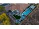 Aerial view of a property featuring a pool, patio, and well-maintained landscaping at 6320 E Gloria Ln, Cave Creek, AZ 85331