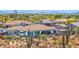Aerial view of a luxury property featuring a large backyard with a pool and desert landscape at 6320 E Gloria Ln, Cave Creek, AZ 85331