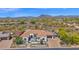Aerial view of a beautiful home with desert landscaping and views of mountains at 6320 E Gloria Ln, Cave Creek, AZ 85331