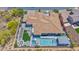 Aerial view of estate featuring pool, spa, outdoor kitchen, seating, and desert landscaping at 6320 E Gloria Ln, Cave Creek, AZ 85331