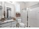 Well-lit bathroom with a granite countertop, shower, and toilet enhanced by natural light at 6320 E Gloria Ln, Cave Creek, AZ 85331