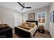 Comfortable bedroom with neutral tones, decorative pillows, and natural light at 6320 E Gloria Ln, Cave Creek, AZ 85331