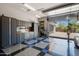 Well-lit garage offers ample storage with custom cabinetry, tiled flooring, and open door at 6320 E Gloria Ln, Cave Creek, AZ 85331