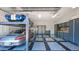 Spacious garage features a car lift, tiled flooring, and ample built-in storage at 6320 E Gloria Ln, Cave Creek, AZ 85331
